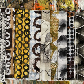 an array of folded fabrics lined up on a table, in black, white, and a some yellow, and bold, hand-painted strokes and patterns, designed by artist e bond