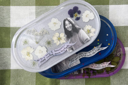 Image of 3 resin trinket trays in a loose stack with photos and quotes to celebrate women's history month