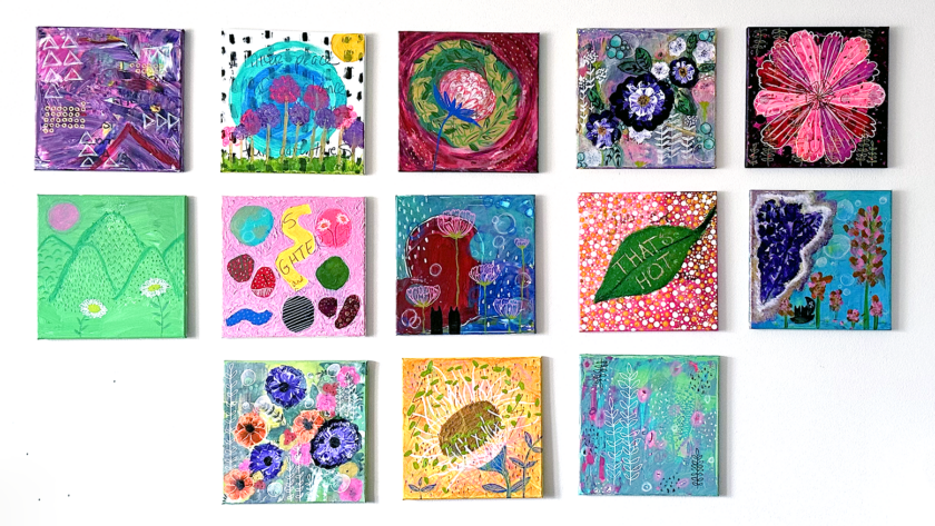 image of a gallery wall of square abstract paintings in many colors