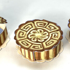images of three handmade paper boxes that look like Chinese mooncakes