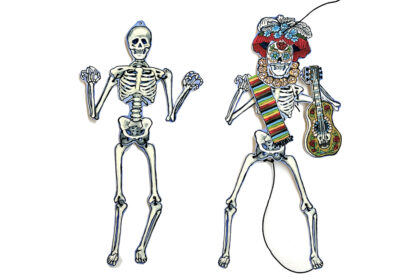 image of 2 small paper skeletons, one wearing a paper crown and holding a guitar and scarf