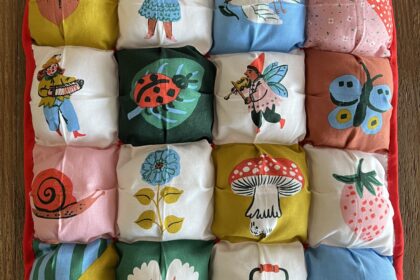 cute square puffy quilt featuring bright colors and cute storybook characters