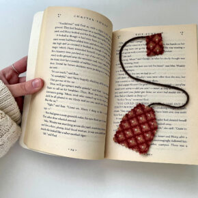 images of a hand opening a book with a tea-bag shaped bookmark inside