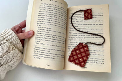 images of a hand opening a book with a tea-bag shaped bookmark inside