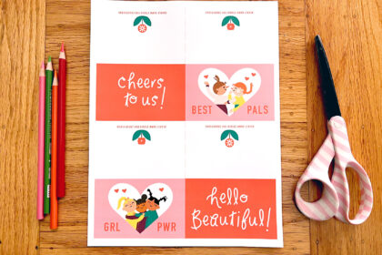 image of materials needed to make a cute Galentine's Day printable card: print-out of PDF art, scissors, and colored pencils
