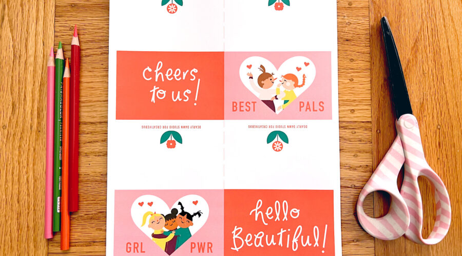 image of materials needed to make a cute Galentine's Day printable card: print-out of PDF art, scissors, and colored pencils