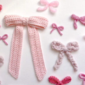 a flat lay of many pink crocheted bows in different shades and sizes and yarns
